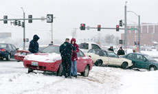 Police interview students caught in a seven-car wreck at the intersection of Duquesne and Newman Roads. No injuries were reported and no ambulance was called to the scene. Some students think the College should have closed down due the inclimate weather.
