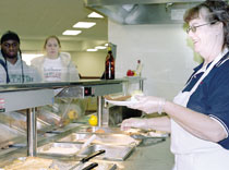 Mandy Betty serves lunch to Southern students. Residence hall students will have two meal plan options, plus meal exchange, during 2003-2004.
