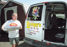 Richard Lawson, owner of LumpyÂ´s B-B-Q, prepares a catered lunch. He said LumpyÂ´s has catered for several area companies, groups and families.s, groups
