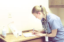 Stephanie Bracken, OccuMed Medical Assistant, prepares an urinary analysis test for a patient. Many area businesses use this form of drug testing.
