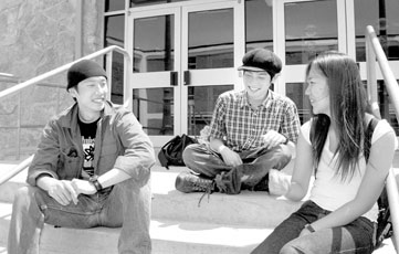 International students, Keishi Kiyomoto, Ryo Takatani and Hyo Sun Choi Dianne, chat outside the Mayes Student Life Center.
