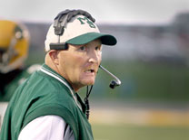Former head football coach Bill Cooke hands in resignation after the Lions are defeated at the Homecoming game.
