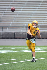 Freshman quarterback Garrett Taylor runs through a practice play Sept. 3 at Hughes Stadium.
