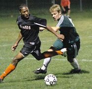J.P. West, sophomore midfielder, attempts to steal the ball from a Missouri Valley College player. The game, held Sept. 26, was postponed due to inclement weather. The game has been rescheduled for Oct. 3.
