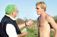 Head menÂ´s cross country coach Tom Rutledge dyed his hair green after the Lions won the conference. Rutledge coaches junior Joel Standeford in preparation for NCAA Division II South Central Regional.
