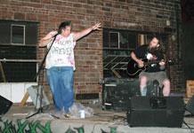 Ryan Smith, left, and Stan Boman of JoplinÂ´s Vaginal Discharge perform a show for a crowd of about 100 people at the all-ages Club Cesspool Sept. 26.
