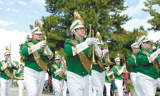 The Missouri Southern marching band heads down University Parkway during the Homecoming parade. Bands from area high schools including Diamond, Lamar and Joplin also participated.

