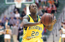 Jeremy Jones, junior guard, prepares to pass the ball during the Feb. 18 home game against Central Missouri State University.
