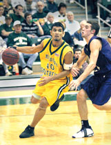 Hiram Ocasio, junior guard, dribbles past an opponent during the Jan. 31 game.

