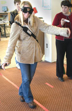 Jenna Muter, sophomore nursing major, walks a line while wearing drinking glasses. The event was held in conjunction with Healthy Relationships Week in the Billingsly Student Center.
