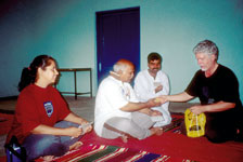 Dr. William Kumbier (far right), professor of English, bids farewell to yoga instructors.
