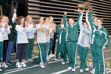 The womenÂ´s indoor track team shows off its trophy following the award ceremony. Both track and field teams claimed MIAA indoor championships Feb. 28 at the Leggett & Platt Athletic Center.
