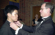Dr. David Ackiss, professor of English, helps junior winner Wenbin Jin with his tie before the MSIPC Gala Winners Concert April 24. Ackiss was JinÂ´s host for his stay in Joplin for the biennial competition.
