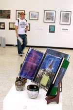 Benjamin ErtelÂ´s artwork, in the foreground, shows a variety of mediums and styles. Southern art students are required to take a variety of studio and design classes.
