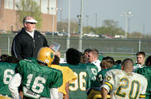 Head coach John Ware talks to the football team after a practice April 13. This football season will be WareÂ´s first at Southern.
