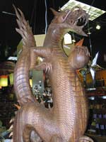 the local specialty import store Romancing the Stone carries such foreign items as a three-and-a-half foot tall dragon, handcarved from a solid pice of teakwood. The dragon would normally be sold for $2,400 but is on sale for $1,200.
