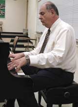 Dr. Al Carnine, professor, often plays piano during class.
