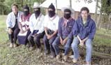 The Zapatista welcoming committee meets with Netza Smith, Chart reporter, to give an interview. For safety reasons and to symbolize their struggle, the woman and the men wear masks.
