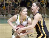 Nicole Greninger, junior guard, fights off a Missouri Western State College defender during the Feb. 26 game.
