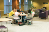 Jiu Guyin (olive green shirt), junior foreign exchange student; (continuing left) Lisha Zhang, junior foreign exchange student; Michah Foreman, OCC student, Melia Moore, OCC student; Nicole Segal, OCC student; Mindy Anderson, OCC student; Bethany Barringer, OCC student have a discussion in the newly remodeled downstairs of Spiva Library Aug. 31.
