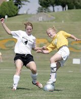 Freshman defender Kelsey Thomas, right, battles for control of the ball during the first half of the Sept. 4 game.
