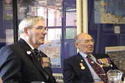 Lionel Emans (left) and Authur Ayshford of the British Infantry, discuss their days in WWII.
