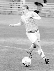 Erin Gfeller, junior midfielder, joined the soccer team after being invited by her friend, Jessica Buhman.
