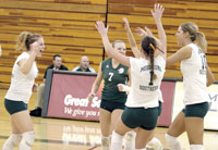 The Lions congratulate each other on a play made during the Oct. 31 match against Drury University. Southern won the match, 3-0.
