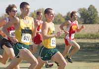 Dustin Dixon, freshman, and Kyle Davis, sophomore, run against MIAA competitors at the conference meet Oct. 22. Dixon and Davis finished in seventh and fifth, repectively.
