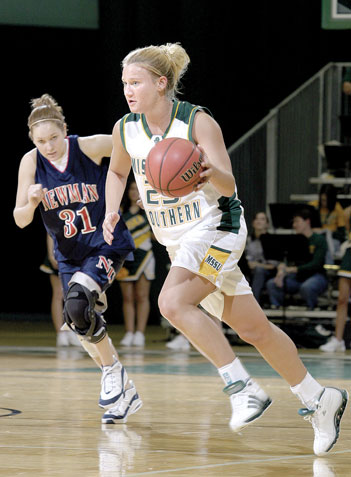 Nacy Thornsberry, freshman guard/forward, dribbles upcourt during the Nov. 30 home game. The women are on a four-game winning-streak.
