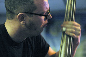 Stevo keeps the beat during Brutally Franks performance on an upright base. The upright bass distinguishes the sound of the bands genre, psychobilly.
