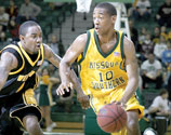 Sophomore guard Daron Harris drives down the court during the second half of the Jan. 28 home game against the Missouri Western State University Griffons. The Lions lost the game 80-63.
