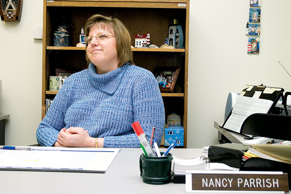Nancy Parrish, secretary of human resources, surrounds her workplace with ceramic lighthouses.
