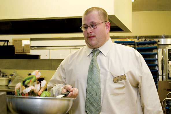 Daniel Macrelli prepared a meal in the Lions Den. Macrelli is the new retail and catering manager with Sodexho.
