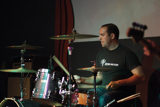David Walker III bangs drums at Dec. 3 True Love Waits concert at Memorial Hall in Joplin.
