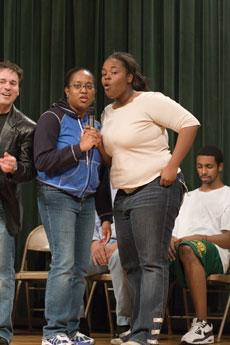 Monique Canada, sophomore pre-med major (left), and JaVan Richardson, freshman undecided major, perform a rap song.
