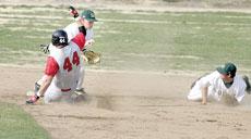 Brett Velliquette, junior outfielder, attempts to tag out his University of Nebraska-Omaha opponent during the March 25 game. Southern lost both games of the double-header, 6-4 and 5-2.
