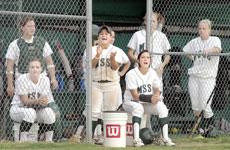 The softball team celebrates a scored run during the April 11 game against Pittsburg State University. The Lions won the first game in the double header 7-6.
