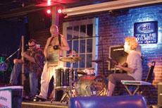 The Ben Miller Band plays at Fat Pats. Left to right Scott Leeper (washtub bass), Doug Dicharry (washboard) and Ben Miller (slide guitar/vocals). The Ben Miller Band will play on campus for finals madness or Southernpalooza on May 10.
