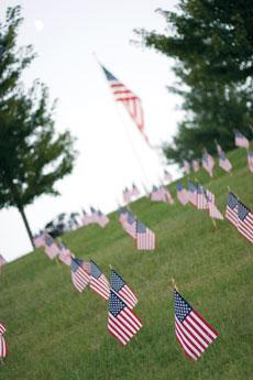 (Right) In the foreground are the flags that were placed by the Missouri Southern College Democrats in honor of soldiers who have died in Iraq and Afghanistan since Sept. 11. In the background is the Flag of Freedom Plaza in Missouri Southerns oval.
