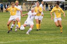 Amy Davis, junior midfielder, steals the ball during the Lions win against Truman State University Oct. 15.
