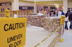 Caution tape blocks off areas of mall flooring receiving new ceramic tile. The Grand Celebration begins Nov. 16 with the ribbon cutting.
