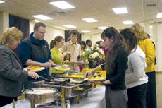 Students and faculty fill their plates at the Martin Luther King Jr. breakfast buffet before hearing Michelle Ducres motivational speech Feb. 12.
