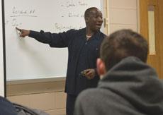 Dr. Nii Abrahams teaches his Principles of Economics course in Plaster Hall April 11. Abrahams is from Ghana.

