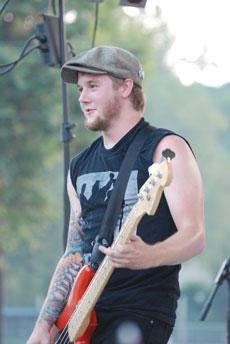 R.J. Jennings plays bass for Cinna The Poet during the festival.
