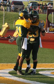 Sophomore wide receiver Isaac Norman (81) celebrates a touchdowns with Colin Bado (23) during last weeks win over Harding.
