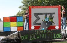 Kyle Buzzard and Josh Gibson of the Sigma Pi fraternity man the groups float during the Homecoming Parade Oct. 13. Sigma Pi captured first place in the best float competition.
