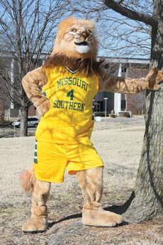 Larry the Lion, aka Joseph Hobbs, poses next to a tree outside of the Leggett & Platt Athletic Center. Hobbs became the new Lion mascot during his second semester on campus.
