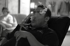 Paul Equihua, junior music education major, smokes peach tobacco at the 12
