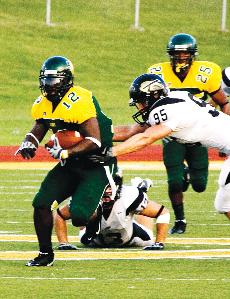 (Above) Southern senior wide receiver Fred Smith (12) breaks away from Harding lineman Josh Brown (95).
